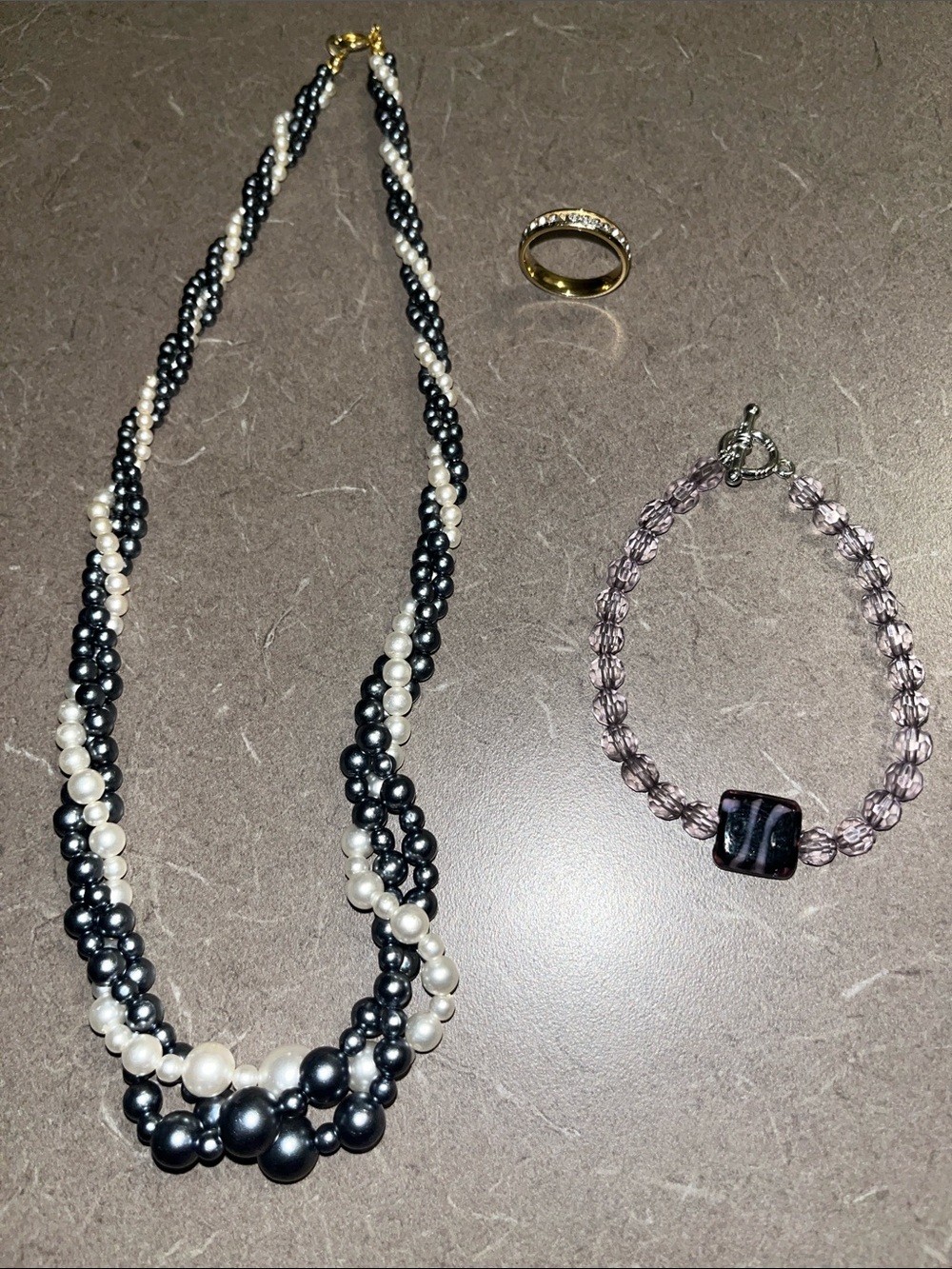Misc jewelry lot - Titanium ring missing two stones As is